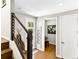 Bright foyer with wood floors, stairs, and convenient access to other areas of the home at 2578 Palau Way, Castle Rock, CO 80109