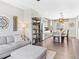Open-concept living space with a seamless transition between the living room, dining area and modern kitchen at 2578 Palau Way, Castle Rock, CO 80109