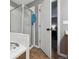 Bathroom showcasing updated shower, tub, and access to the bedroom at 2529 S Truckee Way, Aurora, CO 80013