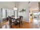 View of the dining room with a table, chairs, a bay window, and a view into the kitchen at 2529 S Truckee Way, Aurora, CO 80013