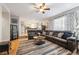 Cozy living room featuring a large sectional sofa and view of the kitchen at 2529 S Truckee Way, Aurora, CO 80013