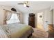 Bedroom with vaulted ceiling, floral curtains, with a view of the bathroom at 2529 S Truckee Way, Aurora, CO 80013