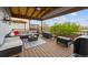 Relax on this cozy porch with wicker furniture, a ceiling fan, and a stunning view at 2529 S Truckee Way, Aurora, CO 80013