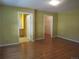 Generously sized bedroom with hardwood floors, attached bathroom, and closet creating a relaxing retreat at 555 Alton Way # E, Denver, CO 80230