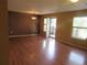 Open living room featuring gleaming hardwood floors and large windows that bring in natural light at 555 Alton Way # E, Denver, CO 80230