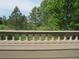 Scenic view from the outdoor deck, overlooking lush greenery and well-manicured lawns at 555 Alton Way # E, Denver, CO 80230