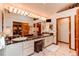 Bright bathroom features dual sinks, a marble countertop, a TV, and recessed lighting at 559 E 2Nd Ave, Castle Rock, CO 80108
