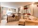 Comfortable bedroom with a wrought iron bed, soft lighting, and draped windows at 559 E 2Nd Ave, Castle Rock, CO 80108