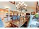 Elegant dining room featuring a large wooden table with seating for six and a decorative chandelier at 559 E 2Nd Ave, Castle Rock, CO 80108