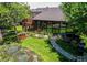 Beautiful home exterior featuring a well-manicured lawn and unique sunroom with expansive windows and charming landscaping at 559 E 2Nd Ave, Castle Rock, CO 80108