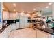 Spacious kitchen with custom cabinets, granite countertops, stainless steel appliances, and a tile floor at 559 E 2Nd Ave, Castle Rock, CO 80108
