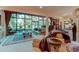 Bright and airy living room featuring a large window, neutral decor, plush seating, and a view of lush greenery at 559 E 2Nd Ave, Castle Rock, CO 80108