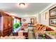 Spacious living room featuring a billiard table, cozy seating, and natural light at 559 E 2Nd Ave, Castle Rock, CO 80108