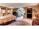 Spacious main bedroom suite with a fireplace, sitting area, and arched doorway leading to a private retreat at 559 E 2Nd Ave, Castle Rock, CO 80108