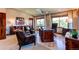 Executive office with hardwood furniture, leather chairs, and a large desk at 559 E 2Nd Ave, Castle Rock, CO 80108