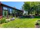 Sunroom with floor to ceiling windows, a water feature, and landscaped backyard at 559 E 2Nd Ave, Castle Rock, CO 80108