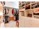 Organized walk-in closet with shelves, drawers, hanging rods, and a plush stool at 559 E 2Nd Ave, Castle Rock, CO 80108