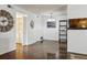 Dining area with wood floors that transitions to the kitchen at 943 S Zeno Way # 207, Aurora, CO 80017