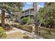Two-story condo featuring a stone chimney and two balconies at 943 S Zeno Way # 207, Aurora, CO 80017