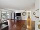 Bright living room featuring wood floors and a sliding glass door to the balcony at 943 S Zeno Way # 207, Aurora, CO 80017