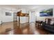 Inviting living space leading to the kitchen with wood flooring at 943 S Zeno Way # 207, Aurora, CO 80017