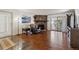 Comfortable living room with a stone fireplace and access to the balcony at 943 S Zeno Way # 207, Aurora, CO 80017
