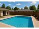 A backyard pool featuring crystal blue water, concrete pool deck and privacy fence at 943 S Zeno Way # 207, Aurora, CO 80017
