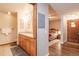Bright bathroom featuring double vanity, tile flooring, and easy access to the bedroom at 655 Four O Clock Rd # 104, Breckenridge, CO 80424
