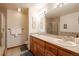 Bathroom featuring a large double vanity, tiled walls, and shower at 655 Four O Clock Rd # 104, Breckenridge, CO 80424