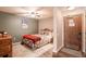 Comfortable bedroom includes a rustic wood dresser and ski themed artwork, creating a mountain retreat at 655 Four O Clock Rd # 104, Breckenridge, CO 80424