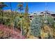 Ski lift in front of condo building, surrounded by evergreen trees at 655 Four O Clock Rd # 104, Breckenridge, CO 80424