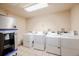 Convenient laundry room equipped with multiple washers and dryers at 655 Four O Clock Rd # 104, Breckenridge, CO 80424