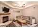 Cozy living room with stone fireplace, comfortable seating, and a rustic wood coffee table at 655 Four O Clock Rd # 104, Breckenridge, CO 80424
