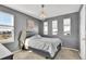 Charming bedroom with a chandelier, three windows, and mountain views at 13464 E 107Th Ave, Commerce City, CO 80022