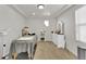 The bedroom features neutral paint, recessed lighting, and a window. Currently outfitted as a massage room at 13464 E 107Th Ave, Commerce City, CO 80022