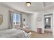 Bright bedroom with a large window and a vanity at 13464 E 107Th Ave, Commerce City, CO 80022