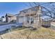 Charming home with a covered porch, fenced yard, and lush landscaping providing privacy and curb appeal at 13464 E 107Th Ave, Commerce City, CO 80022