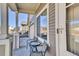 Cozy front porch with a table and chairs, ideal for enjoying morning coffee or evening sunsets at 13464 E 107Th Ave, Commerce City, CO 80022