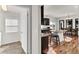Bright kitchen features dark wood cabinets, granite countertops, a breakfast bar, and stainless steel appliances at 13464 E 107Th Ave, Commerce City, CO 80022