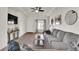 Bright living room with a comfortable sofa, neutral decor, and ample natural light creating a welcoming atmosphere at 13464 E 107Th Ave, Commerce City, CO 80022