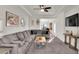 Spacious living room with a large sectional sofa, perfect for relaxing or entertaining guests at 13464 E 107Th Ave, Commerce City, CO 80022