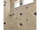 Walk-in shower with decorative tile, window, and built-in shelf at 13464 E 107Th Ave, Commerce City, CO 80022
