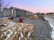 A single-story home with an attached garage is surrounded by a well maintained yard at 27699 E 7Th Ln, Aurora, CO 80018