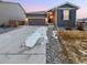 Charming single-story home with a well-maintained lawn and a two-car garage at 27699 E 7Th Ln, Aurora, CO 80018