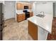 A well-lit kitchen features stainless steel appliances and light countertops at 27699 E 7Th Ln, Aurora, CO 80018