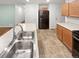 Kitchen island with a stainless steel sink and ample counter space at 27699 E 7Th Ln, Aurora, CO 80018