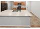 Kitchen island featuring a dual sink and plentiful counter space at 27699 E 7Th Ln, Aurora, CO 80018