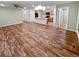 Spacious living room area showcases beautiful wood-look floors and great natural light at 27699 E 7Th Ln, Aurora, CO 80018