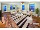 Bright living room featuring hardwood floors and a plush area rug at 27699 E 7Th Ln, Aurora, CO 80018
