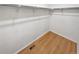 Walk-in closet with shelving and hardwood flooring at 27699 E 7Th Ln, Aurora, CO 80018